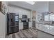 Modern kitchen featuring granite countertops, stainless steel appliances, and ample cabinet space at 140 Surrey Park Dr, Fayetteville, GA 30215