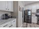 Modern kitchen featuring stainless steel appliances, white cabinets, and granite countertops at 140 Surrey Park Dr, Fayetteville, GA 30215