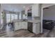 Bright kitchen featuring white cabinets, granite countertops, and stainless steel dishwasher at 140 Surrey Park Dr, Fayetteville, GA 30215