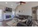 Comfortable living room featuring a fireplace, a large sectional sofa, and a TV at 140 Surrey Park Dr, Fayetteville, GA 30215