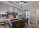 Well decorated main bedroom with trey ceilings, wood floors, and access to en-suite bathroom at 140 Surrey Park Dr, Fayetteville, GA 30215