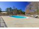 A backyard in-ground pool with lounge chairs, offers a relaxing and private outdoor oasis at 140 Surrey Park Dr, Fayetteville, GA 30215