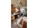 Functional kitchen with wood cabinets, black appliances, and plenty of countertop space for meal preparation at 775 Windemere Oak Nw Way, Lilburn, GA 30047