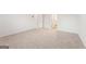 Expansive bedroom featuring neutral carpet, two doors, and versatile space for furniture and decor at 8516 (Lot 130) Polston Place Dr, Douglasville, GA 30134