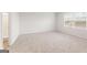 Spacious bedroom boasts neutral carpet, ample natural light from the window, and an adjoining bathroom with a shower at 8516 (Lot 130) Polston Place Dr, Douglasville, GA 30134