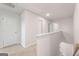 Bright hallway with neutral carpet and white walls creates a clean, modern aesthetic at 8516 (Lot 130) Polston Place Dr, Douglasville, GA 30134