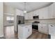 Modern kitchen featuring stainless steel appliances, white cabinetry and a center island at 80 Rosemoore Dr, Covington, GA 30014