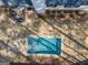 Aerial view of in-ground pool surrounded by stone pavers, backyard and home at 100 Lanyard Bnd, Peachtree City, GA 30269
