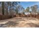 Spacious backyard with wood fence and stone pavers at 100 Lanyard Bnd, Peachtree City, GA 30269