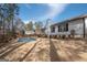 Beautiful backyard with an inviting swimming pool, surrounded by lush greenery and a sturdy privacy fence at 100 Lanyard Bnd, Peachtree City, GA 30269