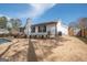 Expansive backyard featuring a well-maintained lawn and privacy fence, perfect for outdoor enjoyment at 100 Lanyard Bnd, Peachtree City, GA 30269