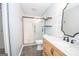 Updated bathroom featuring a shower with glass doors, a vanity and modern fixtures at 100 Lanyard Bnd, Peachtree City, GA 30269