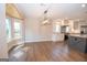 Open dining area with natural light and views of the modern kitchen at 100 Lanyard Bnd, Peachtree City, GA 30269