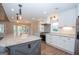 Modern kitchen featuring a central island, stainless steel appliances, and ample counter space at 100 Lanyard Bnd, Peachtree City, GA 30269