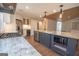 Well-equipped kitchen featuring a granite island, stainless steel appliances, and modern fixtures at 100 Lanyard Bnd, Peachtree City, GA 30269