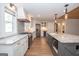 Spacious kitchen boasts granite countertops, stainless steel appliances, and a stylish central island at 100 Lanyard Bnd, Peachtree City, GA 30269