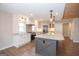 Bright kitchen featuring granite countertops, a modern island, and ample cabinet space at 100 Lanyard Bnd, Peachtree City, GA 30269