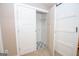 View of the laundry room with patterned tile floor and sliding barn door at 100 Lanyard Bnd, Peachtree City, GA 30269