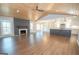 Open-concept living area with wood ceiling, fireplace, and an island kitchen, blending style and functionality at 100 Lanyard Bnd, Peachtree City, GA 30269