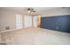 Carpeted main bedroom showcasing large closet and paneled accent wall at 100 Lanyard Bnd, Peachtree City, GA 30269