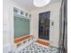 Mudroom with trendy flooring, storage hooks, shelves and bench at 100 Lanyard Bnd, Peachtree City, GA 30269