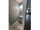 A convenient half bath featuring pedestal sink, light fixture, and tile floors at 2747 Vining Ridge Ter, Decatur, GA 30034