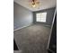 Cozy bedroom featuring soft carpet and a bright window for natural light at 2747 Vining Ridge Ter, Decatur, GA 30034