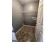 A convenient laundry room with tile flooring and built in shelving at 2747 Vining Ridge Ter, Decatur, GA 30034