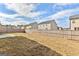 Expansive backyard with a wooden fence providing privacy and a concrete section, ideal for entertaining and leisure at 1756 Beckworth Ln, Hampton, GA 30228