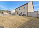 A vast backyard surrounded by a privacy fence, great for Gathering fun, barbecues, and outdoor entertaining on the concrete patio at 1756 Beckworth Ln, Hampton, GA 30228