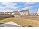A spacious backyard with a wood fence and a small concrete patio area, perfect for outdoor activities and relaxation at 1756 Beckworth Ln, Hampton, GA 30228