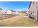 Fenced backyard with a clear sky and a grill and trashcan in the corner, perfect for outdoor enjoyment and activities at 1756 Beckworth Ln, Hampton, GA 30228