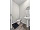Bathroom featuring a pedestal sink and black rug at 1756 Beckworth Ln, Hampton, GA 30228