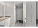Bathroom with single sink vanity, tiled floors, and nearby toilet and shower at 1756 Beckworth Ln, Hampton, GA 30228