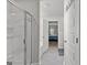 Bathroom features a shower, a toilet, and an entryway into an adjacent bedroom at 1756 Beckworth Ln, Hampton, GA 30228