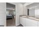 En-suite bathroom with double sinks, a large mirror and an adjoining bedroom at 1756 Beckworth Ln, Hampton, GA 30228
