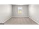 Bedroom featuring neutral walls and carpet with a window and natural light at 1756 Beckworth Ln, Hampton, GA 30228