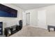 Bedroom showcasing a television, speakers, and modern decor against a light wall at 1756 Beckworth Ln, Hampton, GA 30228