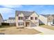Beautiful two-story home showcasing brick exterior, attached garage, and a neatly kept front yard at 1756 Beckworth Ln, Hampton, GA 30228