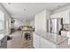 Kitchen with stainless steel appliances and dining area that flows into the living room at 1756 Beckworth Ln, Hampton, GA 30228