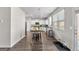 Eat-in kitchen featuring white cabinets, an island, and stainless steel appliances at 1756 Beckworth Ln, Hampton, GA 30228