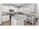 Bright kitchen with white cabinets, granite countertops, and stainless steel appliances at 1756 Beckworth Ln, Hampton, GA 30228