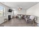 Spacious living room with a fireplace, ceiling fan, and a large sectional couch at 1756 Beckworth Ln, Hampton, GA 30228