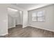 Spacious living room with modern floors, neutral walls, and a large window for ample natural light at 1756 Beckworth Ln, Hampton, GA 30228