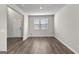 Inviting living area features neutral paint, hardwood floors, and ample natural light at 1756 Beckworth Ln, Hampton, GA 30228