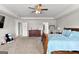 Well-lit main bedroom boasts neutral walls and carpet, a ceiling fan and ample space at 1756 Beckworth Ln, Hampton, GA 30228
