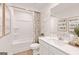 Bright bathroom with a tub, a shower, and a white vanity offering a clean, modern space at 988 Sutherland Lane # 33, Lawrenceville, GA 30043