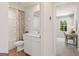 Bathroom featuring a shower, a toilet, and a single vanity with a bright, neutral color palette at 988 Sutherland Lane # 33, Lawrenceville, GA 30043