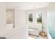 Bright hallway featuring lots of sunlight, a cozy bench, and modern design at 988 Sutherland Lane # 33, Lawrenceville, GA 30043