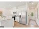 Modern kitchen features stainless steel appliances, white cabinets, and granite countertops at 988 Sutherland Lane # 33, Lawrenceville, GA 30043